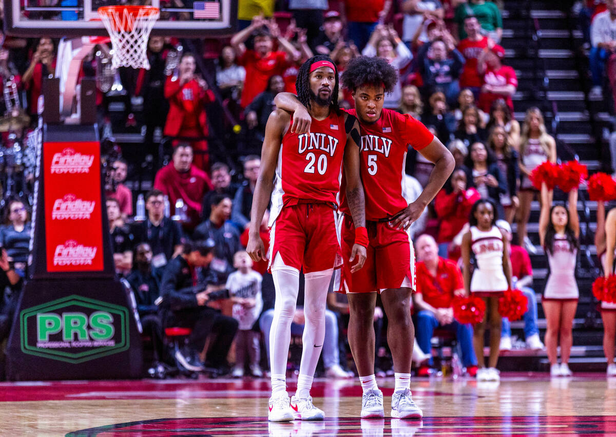 UNLV Rebels forward Keylan Boone (20) and forward Rob Whaley Jr. (5) look on as UNR takes the l ...