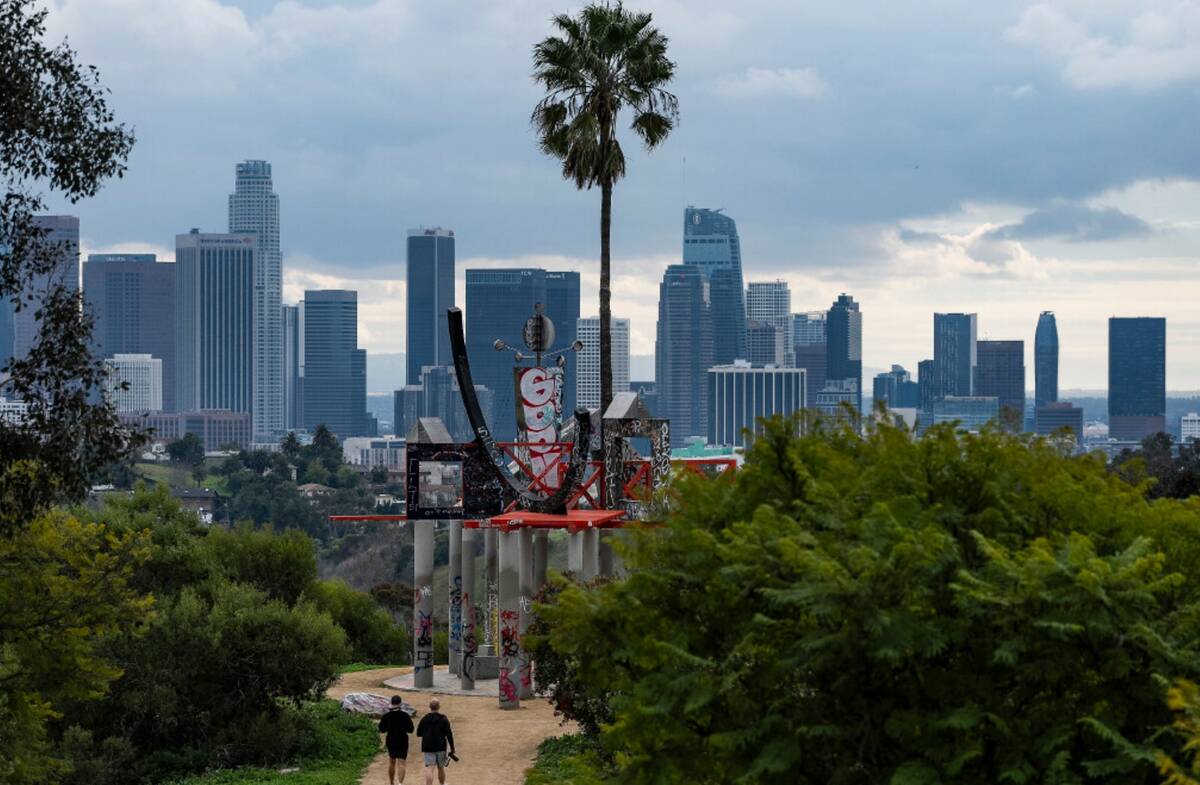 Low clouds gather over the Los Angeles skyline seen from Elysian Park on Sunday, Feb. 18, 2024. ...