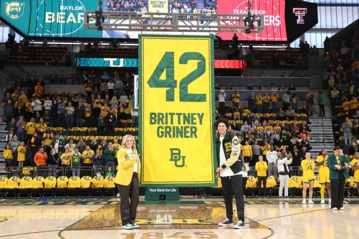 Former Baylor University legend and WNBA star Brittney Griner, right, looks on with Baylor head ...