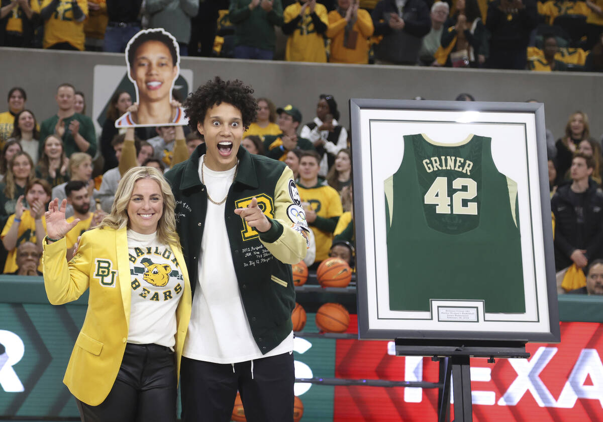 Former Baylor University legend and WNBA star Brittney Griner, right, looks on with Baylor head ...