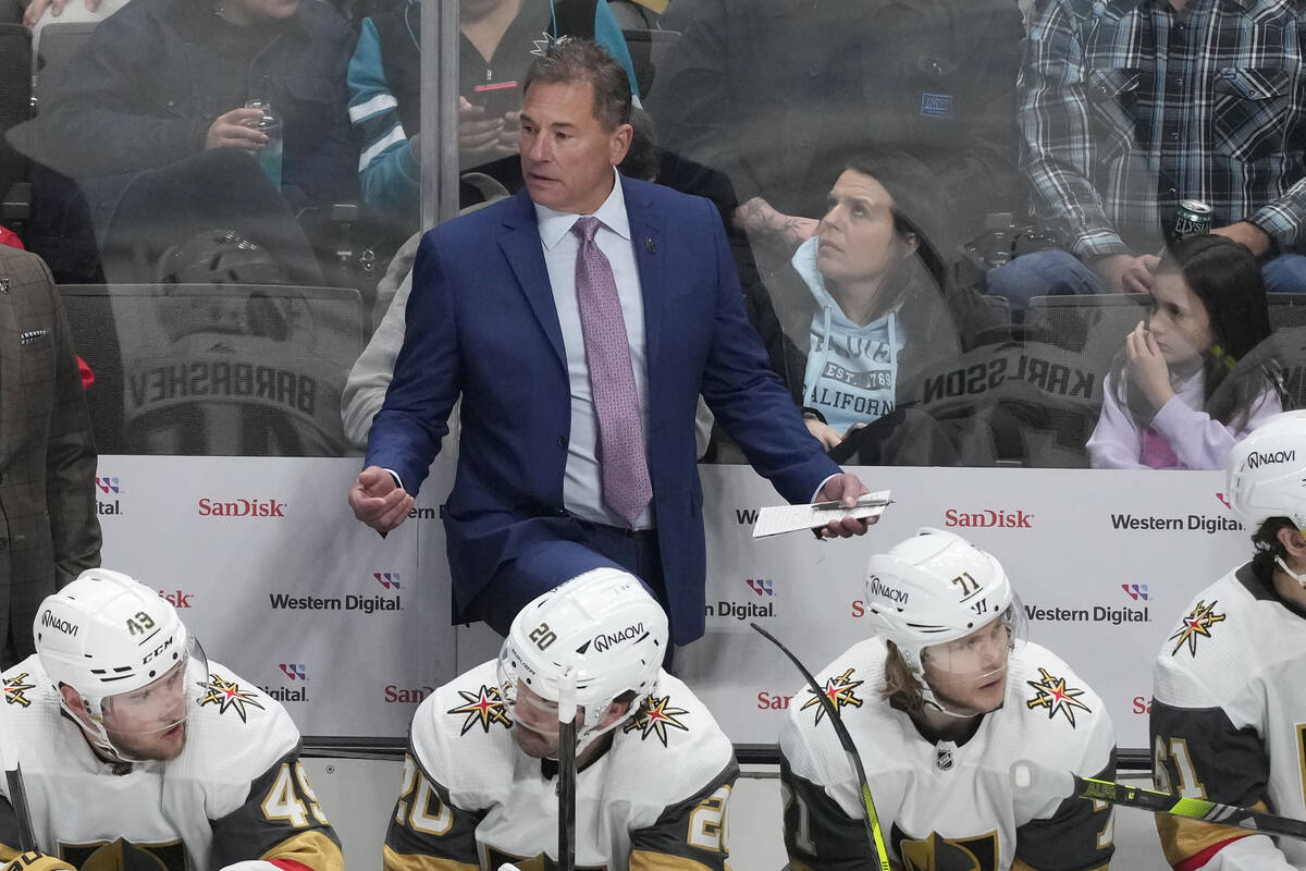 Vegas Golden Knights head coach Bruce Cassidy, standing, gestures behind players during the thi ...