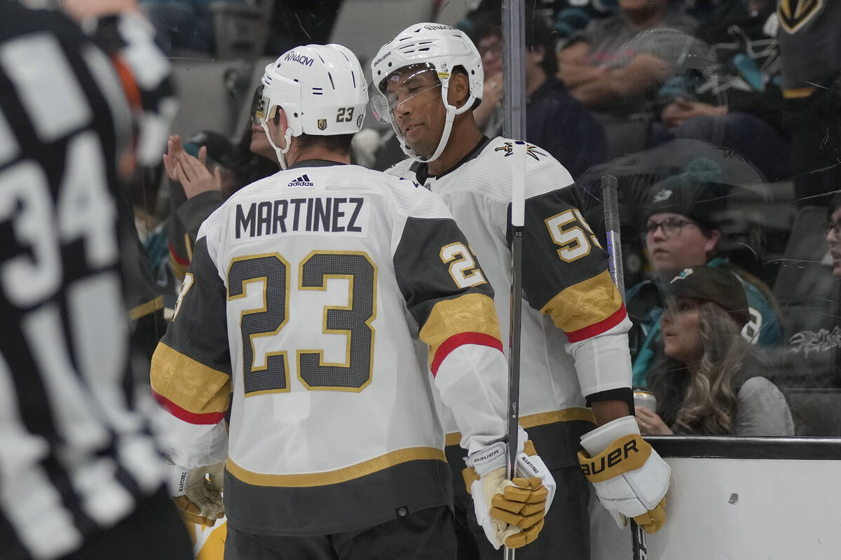 Vegas Golden Knights right wing Keegan Kolesar, right, is congratulated by defenseman Alec Mart ...