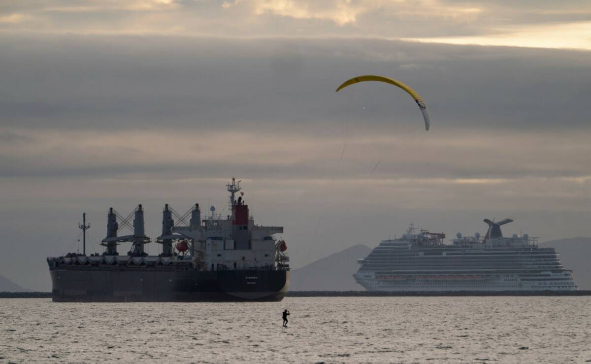 Kite surfer Robert Rice hydrofoils off the Belmont Shore in Long Beach, Calif., on Sunday, Feb. ...