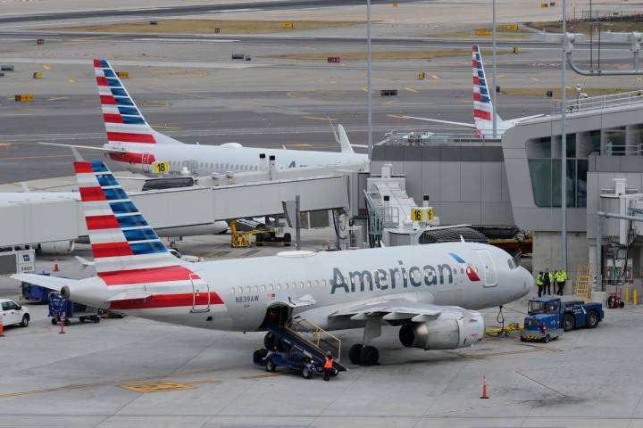 American Airlines planes sit on the tarmac at Terminal B at LaGuardia Airport, Jan. 11, 2023, i ...