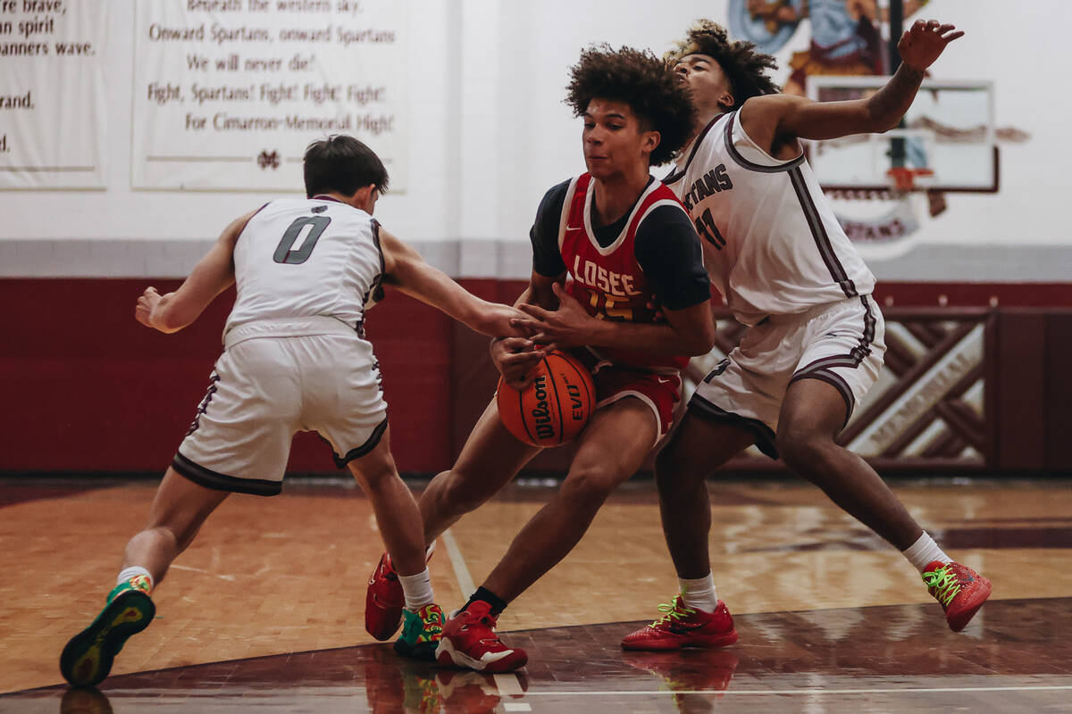 Somerset-Losee guard Kieran Daniel (15) fights to keep the ball in his grip during a game at Ci ...