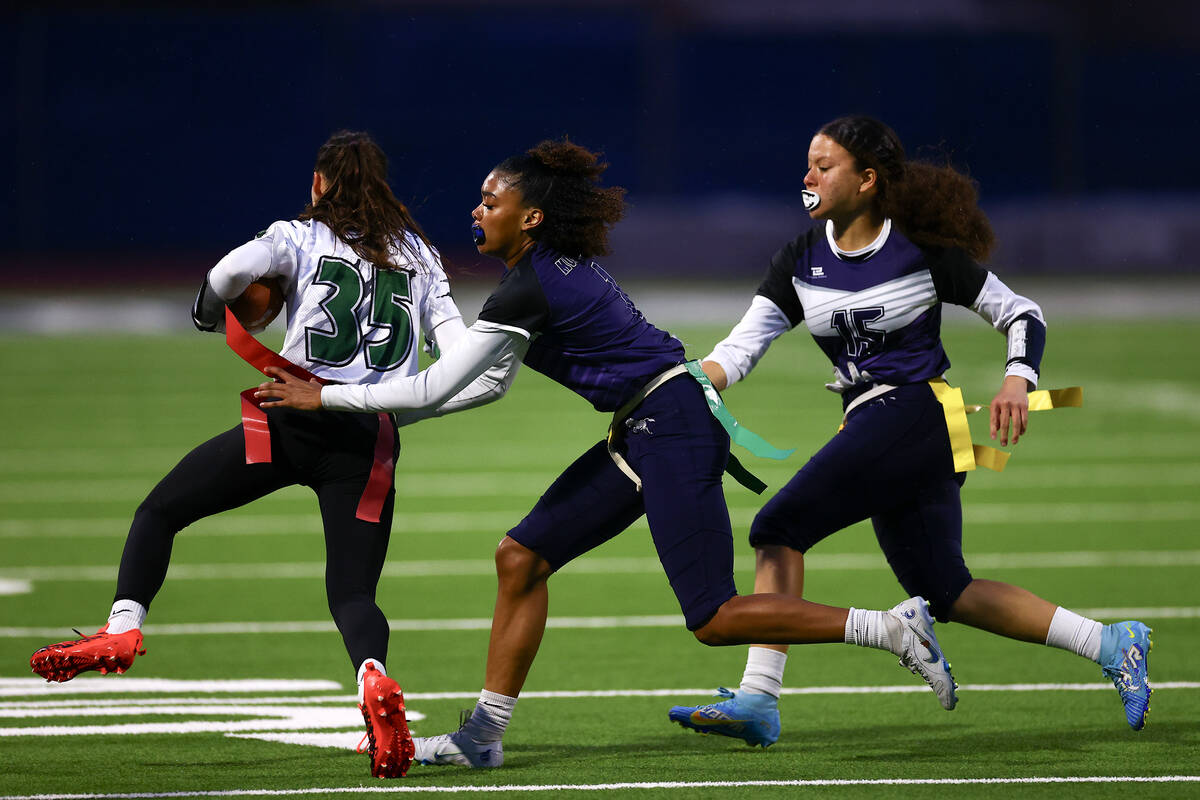 Shadow Ridge's Kyliah Rivera-Kyle (1) takes the flag of Palo Verde's Tia Brown (35) while Shado ...