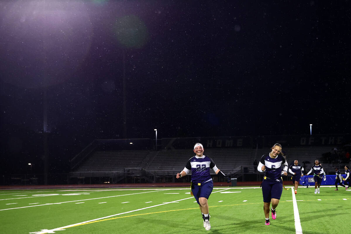 Shadow Ridge's Aubree Davis (22) and Chloe Covington (6) run to celebrate with their team after ...