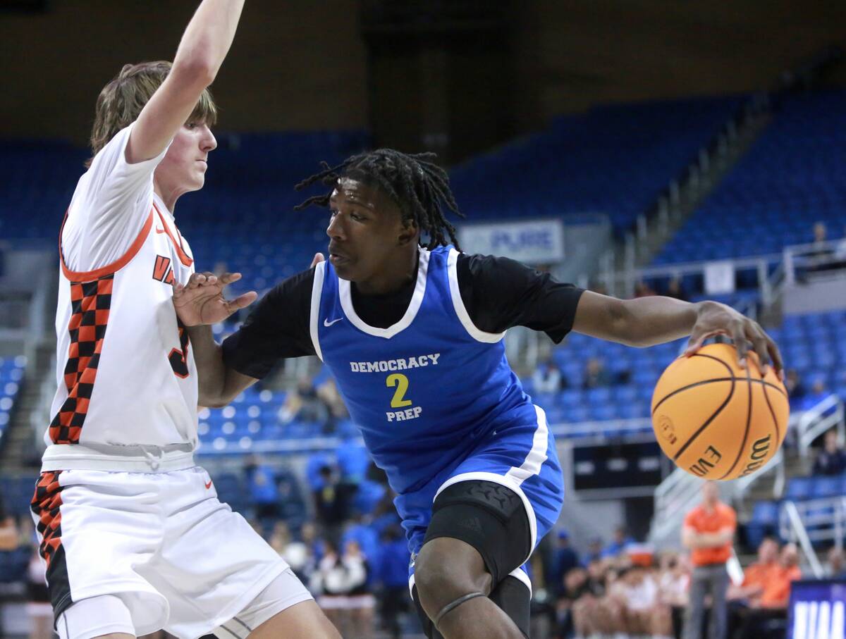 Democracy Prep sophomore guard Josiah Stroughter, right, drives baseline against Fernley sophom ...