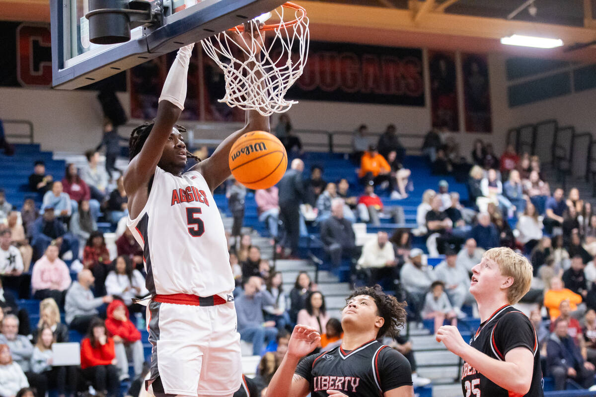 Arbor View’s Pharaoh Compton (5) dunks the ball during a basketball game between Arbor V ...