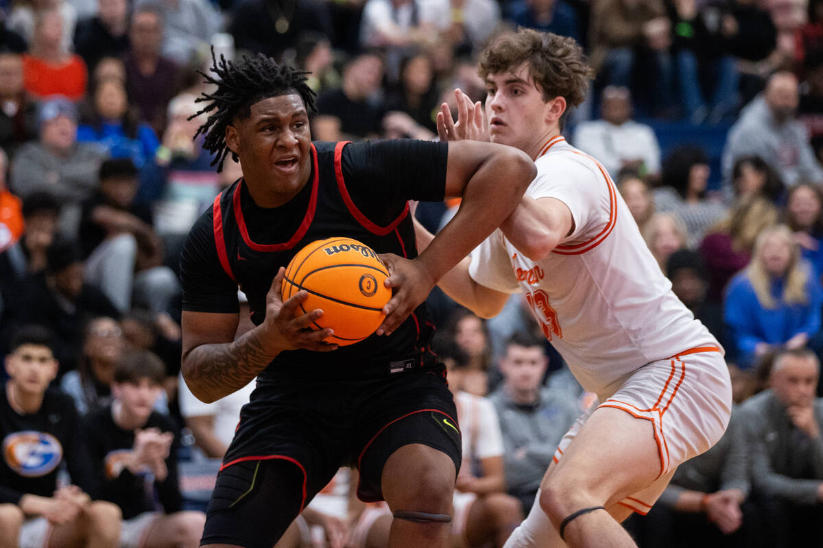 Bishop Gorman’s Noah Westbrook (13) guards Coronado’s Tee Bartlett (13) during a ...