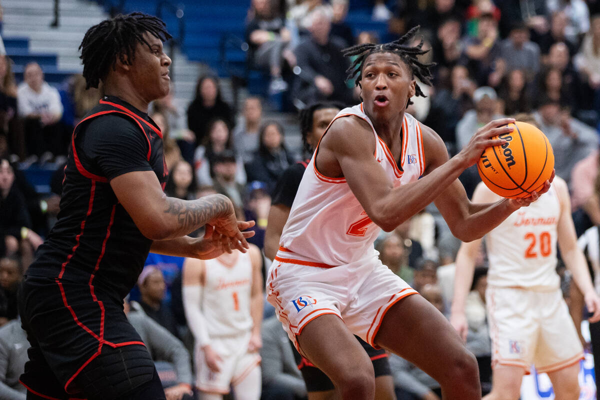 Bishop Gorman’s Jett Washington (2) looks to pass the ball during a basketball game betw ...