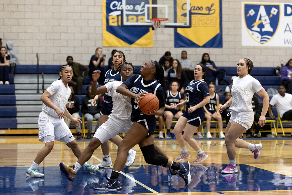 Shadow Ridge’s Zh’mya Martin (5) drives toward the hoop against Democracy Prep&#x ...