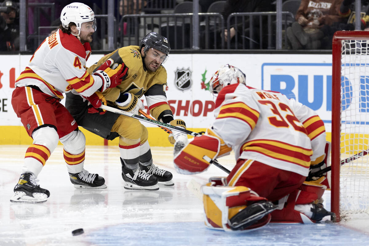 Golden Knights left wing William Carrier (28) passes the puck down the ice to attempt an assist ...