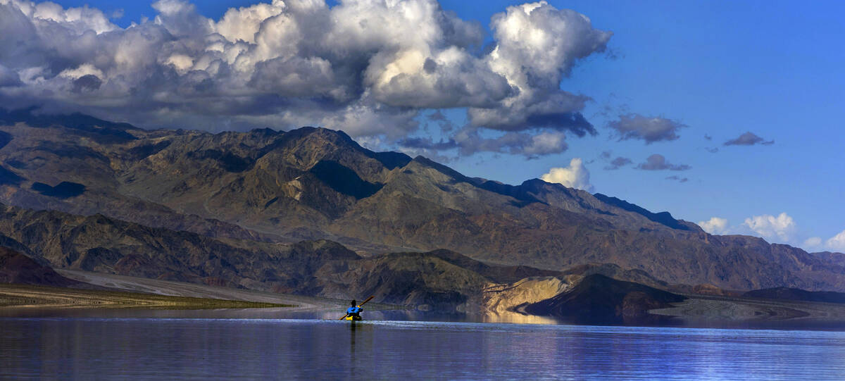 Ashley Lee, president of the Amargosa Conservancy, kayaks on the temporary Lake Manly at Badwat ...