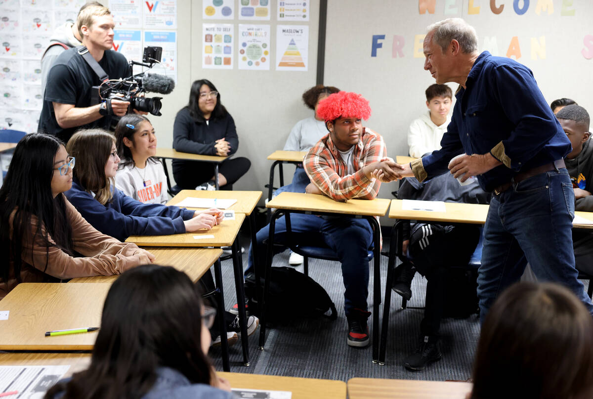 Mike Rowe of “Dirty Jobs” greets student Lyric Rojas, 16, while talking to students in a fr ...