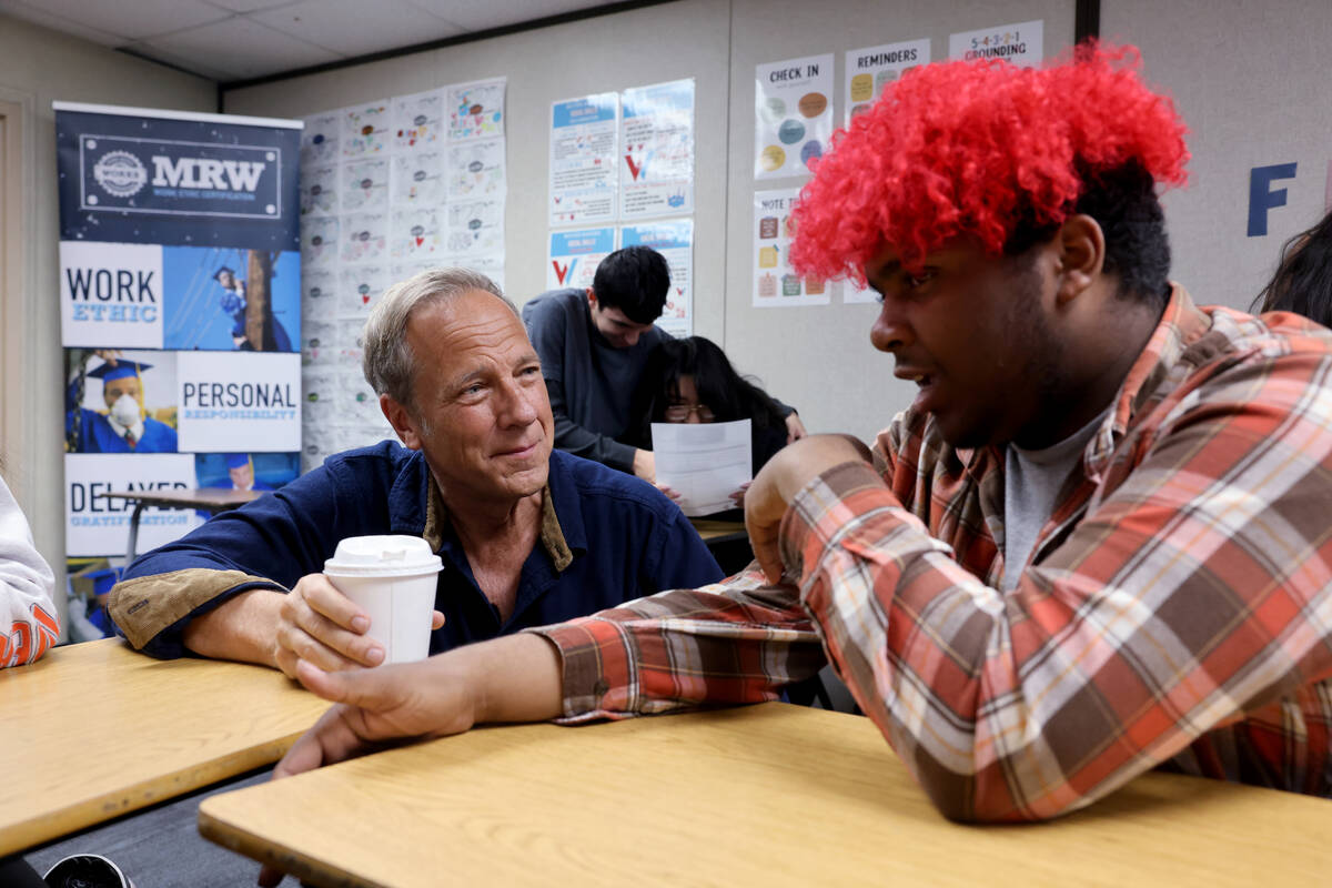 Mike Rowe of “Dirty Jobs” talks with student Lyric Rojas, 16, at Western High School on Mon ...