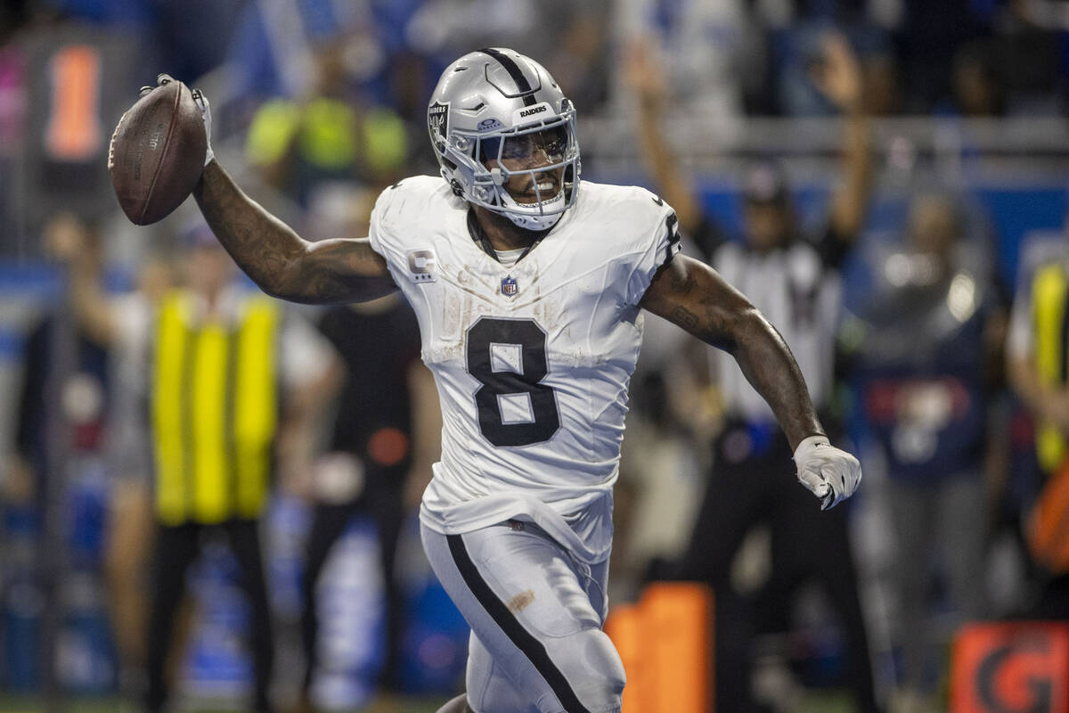 Raiders running back Josh Jacobs (8) spikes the football after his touchdown score during the f ...