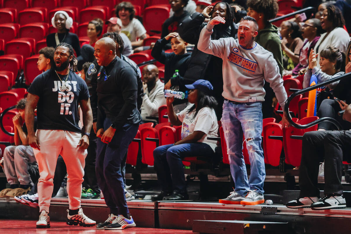 Bishop Gorman girls basketball fans celebrate during a Class 5A girls basketball state semifina ...