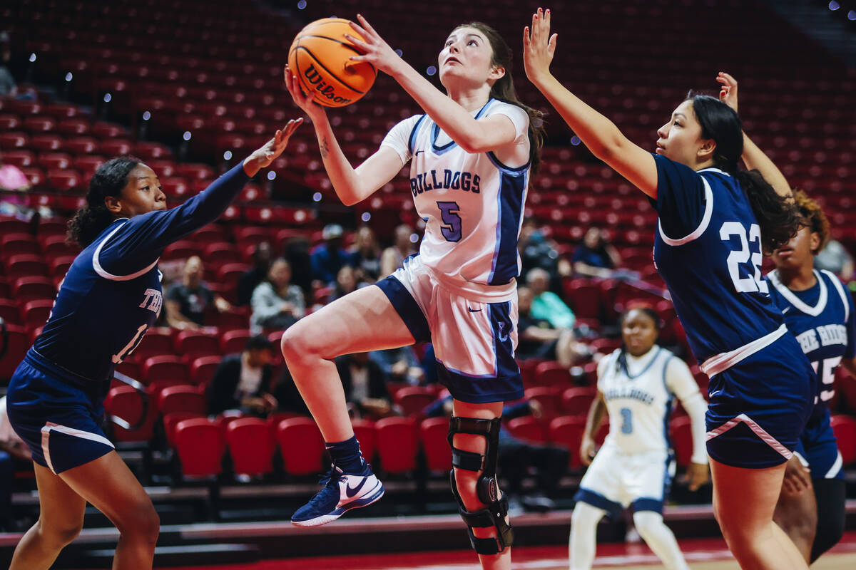 Centennial’s Trysta Barrett (5) goes for a layup during a Class 5A girls basketball state sem ...