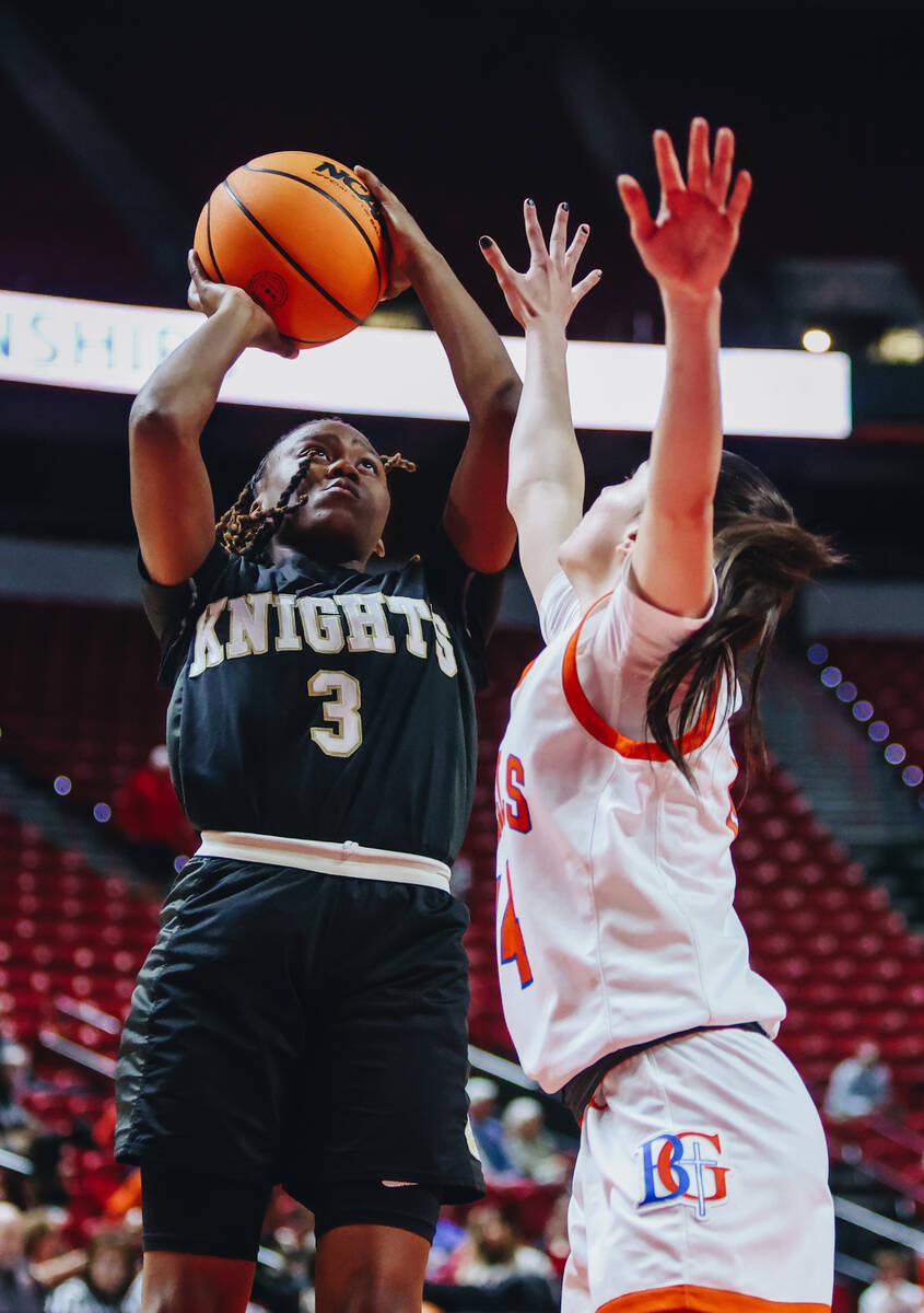 Democracy Prep point guard Bray’ana Miles (3) fights to shoot the ball into the hoop during a ...