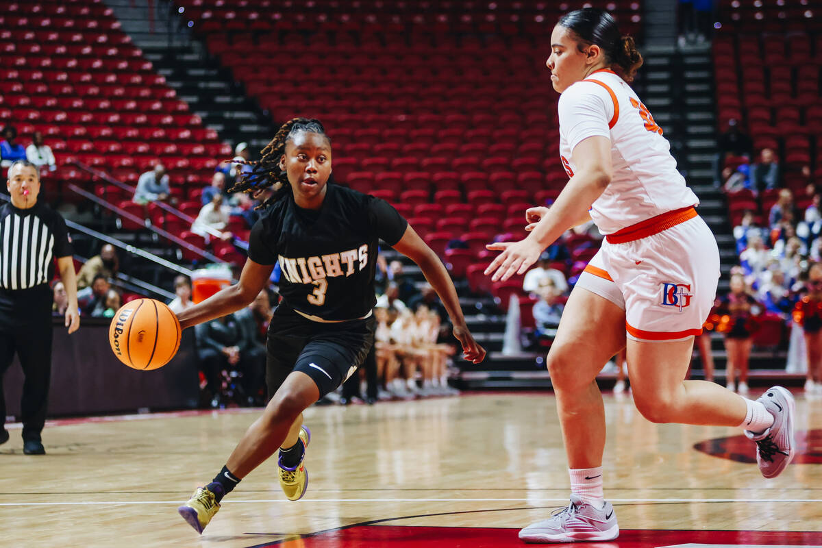 Democracy Prep point guard Bray’ana Miles (3) drives the ball to the hoop during a Class 5A g ...