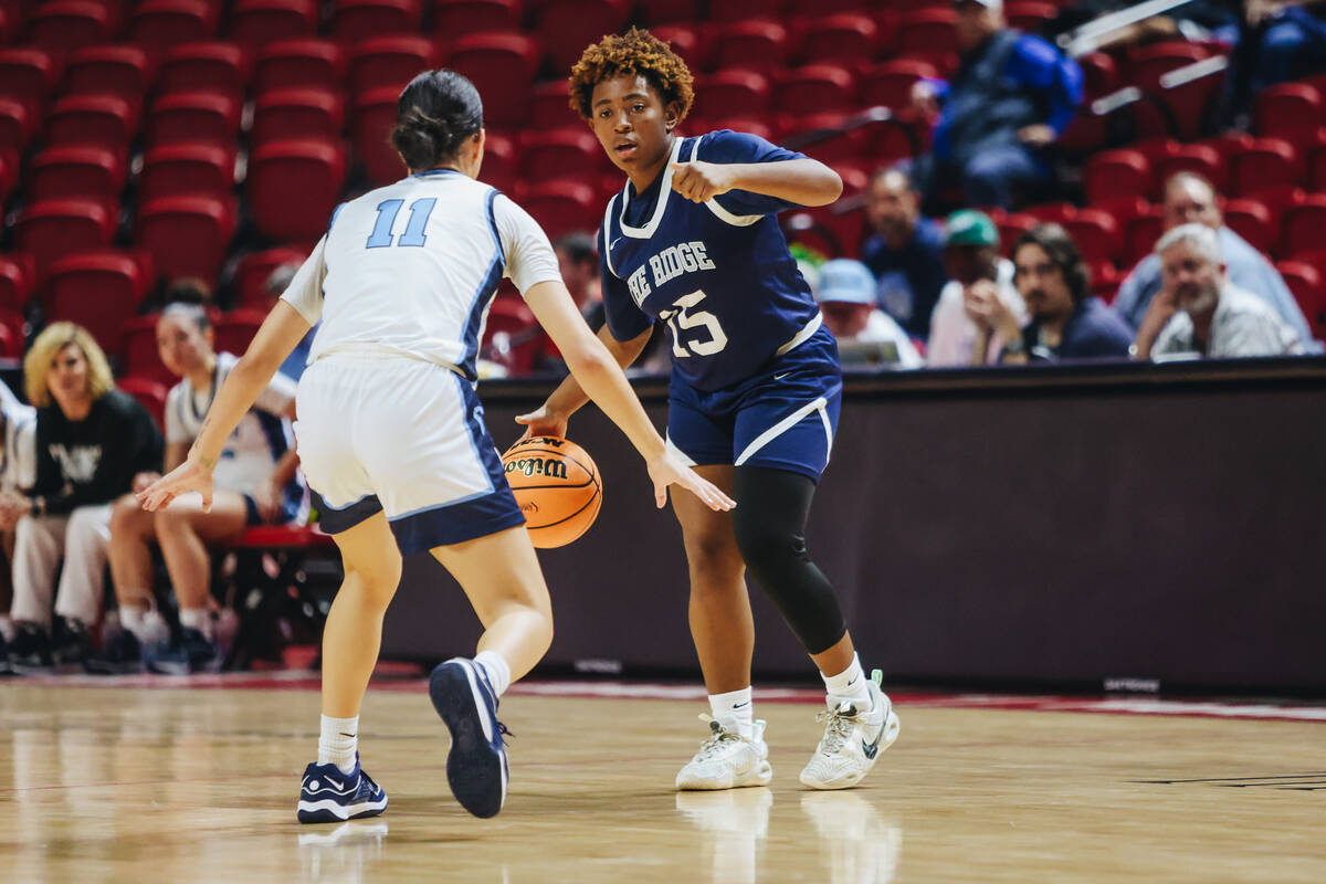 Shadow Ridge’s Jada Livingston (15) signals to a teammate as she dribbles the ball during a C ...