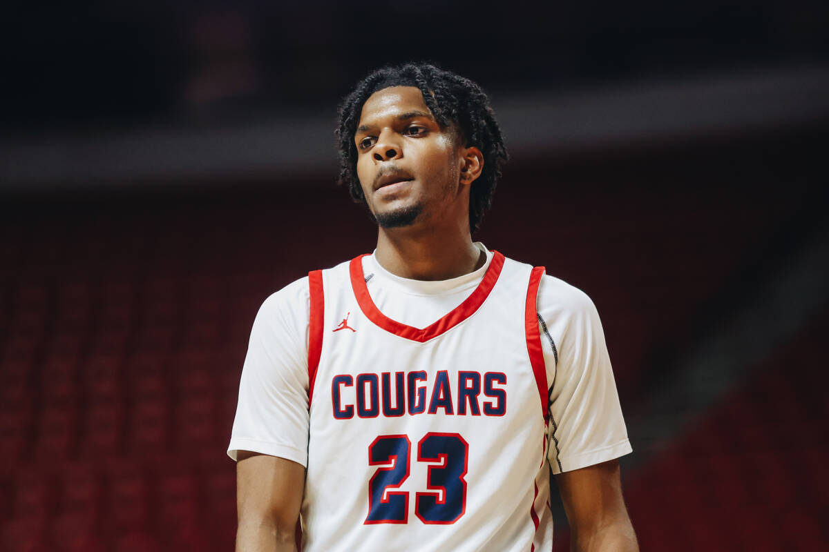 Coronado guard Josiah Cunningham (23) takes a moment during a time out at a Class 5A boys baske ...