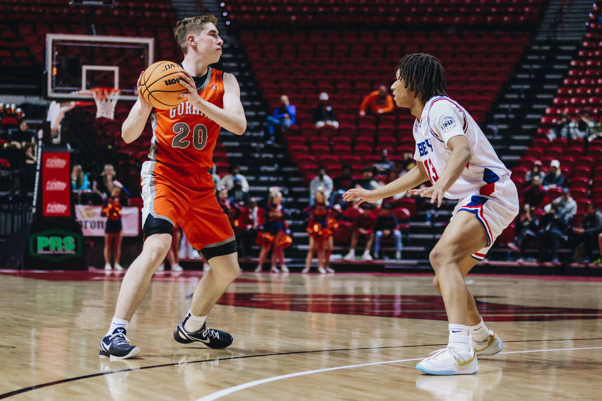 Bishop Gorman’s Ilan Nikolov (20) looks to pass the ball to a teammate during a Class 5A boys ...