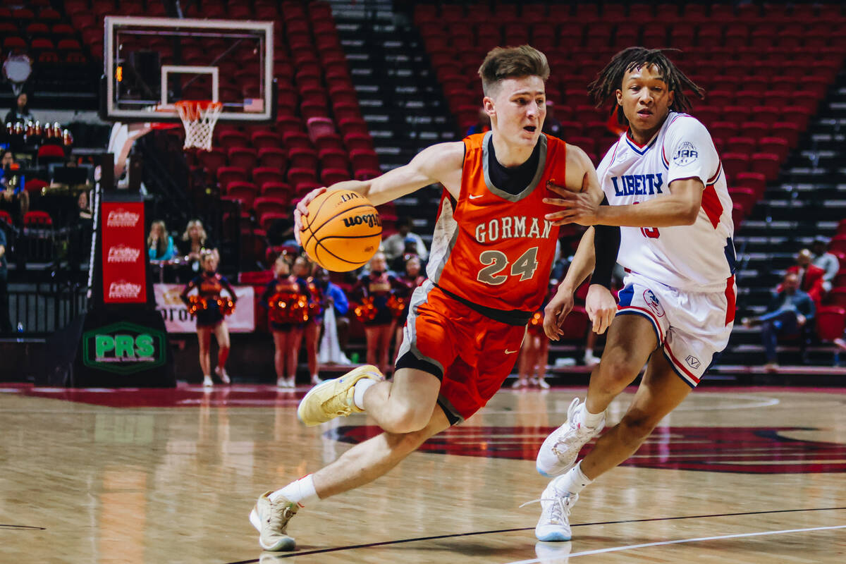 Bishop Gorman guard Ryder Elisaldez (24) drives the ball to the net during a Class 5A boys bask ...