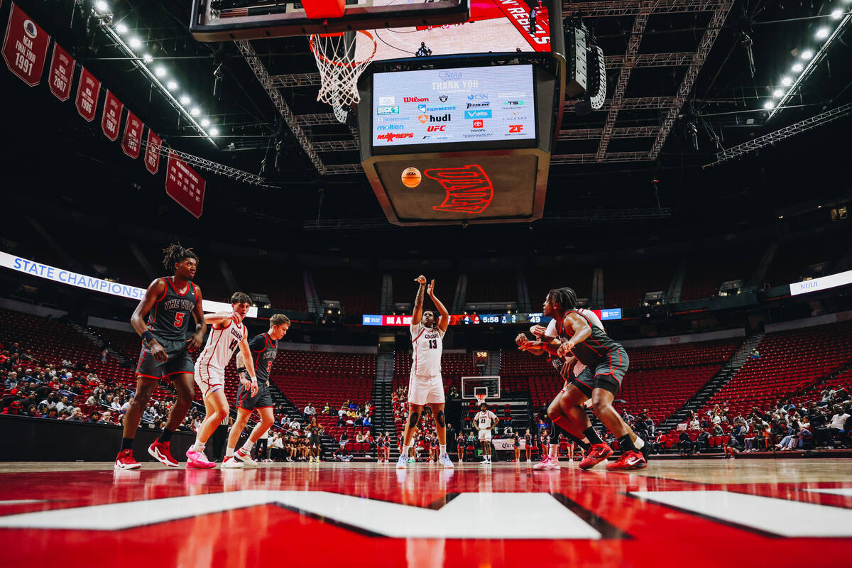 Coronado center Tee Bartlett (13) shoots a free throw during a Class 5A boys basketball state s ...