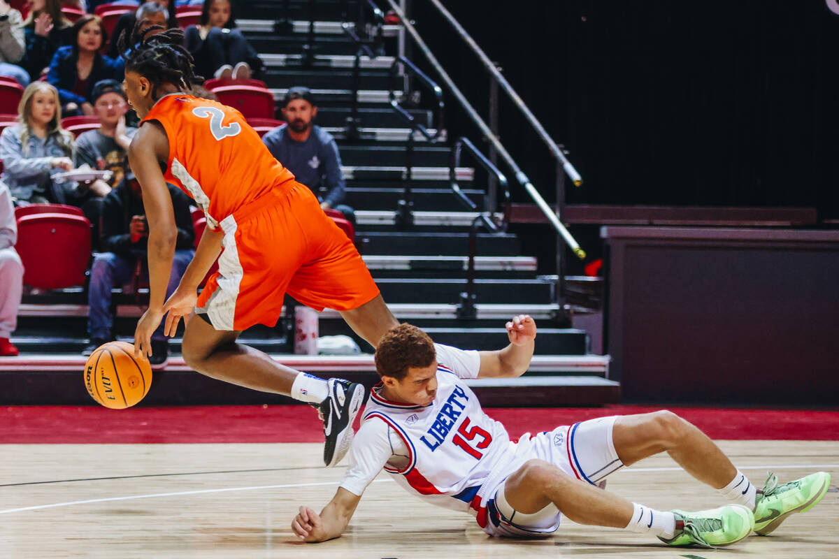 Bishop Gorman small forward Jett Washington (2) runs off with the ball as Liberty small forward ...