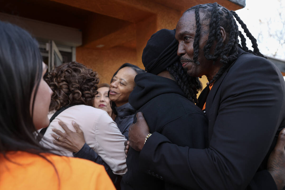Founder Robert Strawder, right, embraces community members after officially opening the Donna S ...