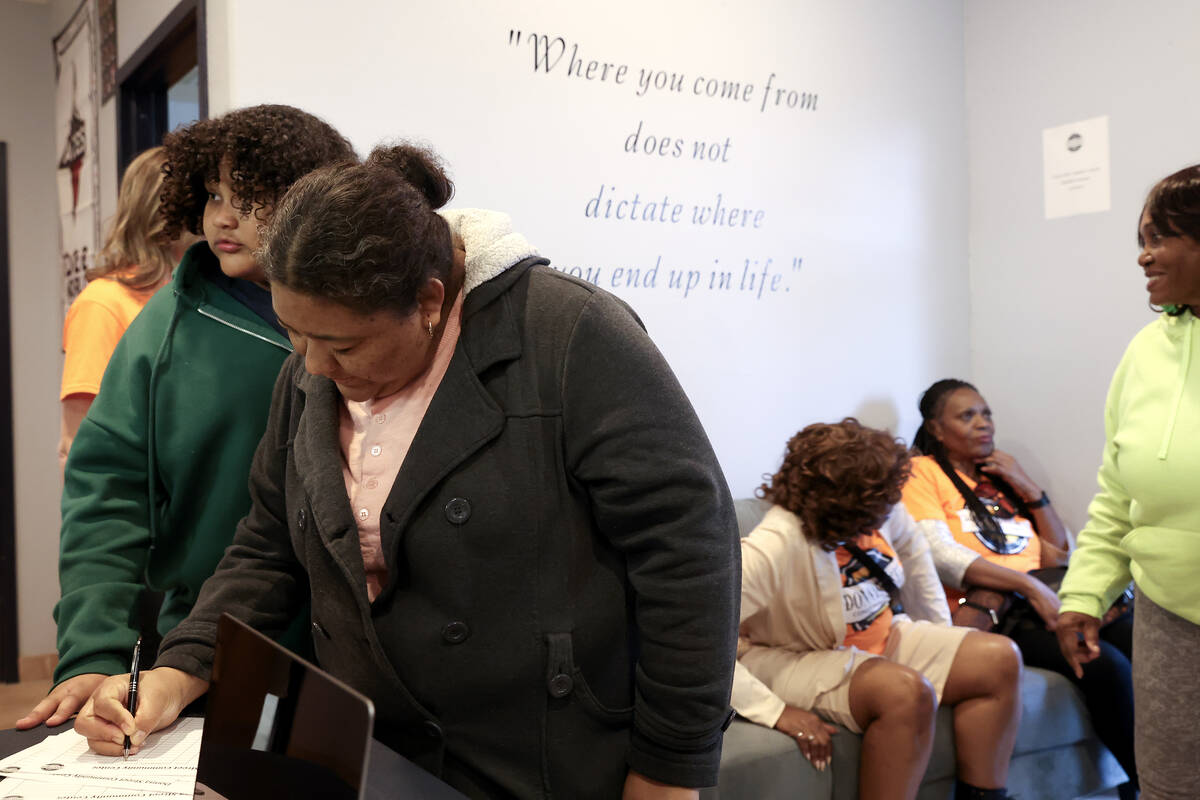 Community members file into the new the Donna Street Community Center during its opening event ...