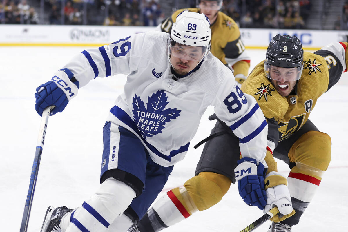 Toronto Maple Leafs left wing Nicholas Robertson (89) skates past Vegas Golden Knights defensem ...