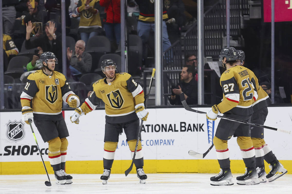 Vegas Golden Knights center William Karlsson, left, celebrates with right wing Jonathan Marches ...