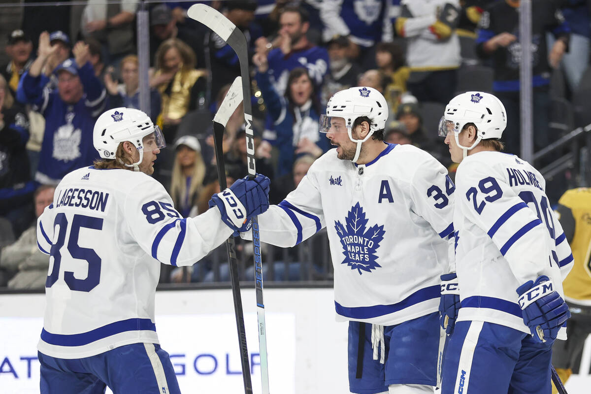 Toronto Maple Leafs defenseman William Lagesson (85) and right wing Pontus Holmberg (29) celebr ...