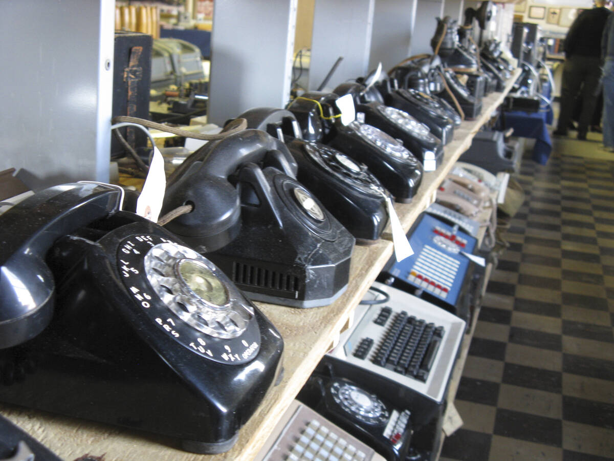 In a Saturday Nov. 12, 2011 photo, rows of old and newer telephones along with office switchboa ...