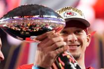 Kansas City Chiefs quarterback Patrick Mahomes holds the Vince Lombardi Trophy after the NFL Su ...