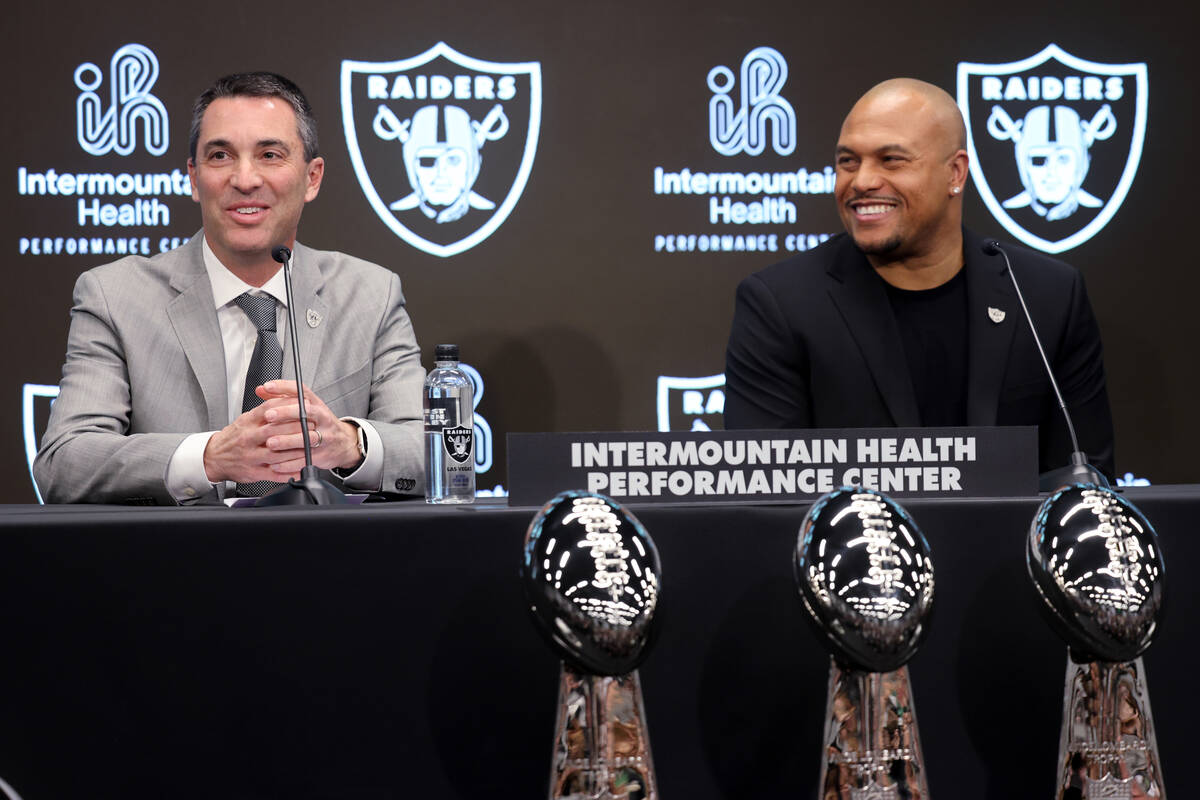 Tom Telesco, left, and Antonio Pierce are introduced as general manager and coach during a pres ...