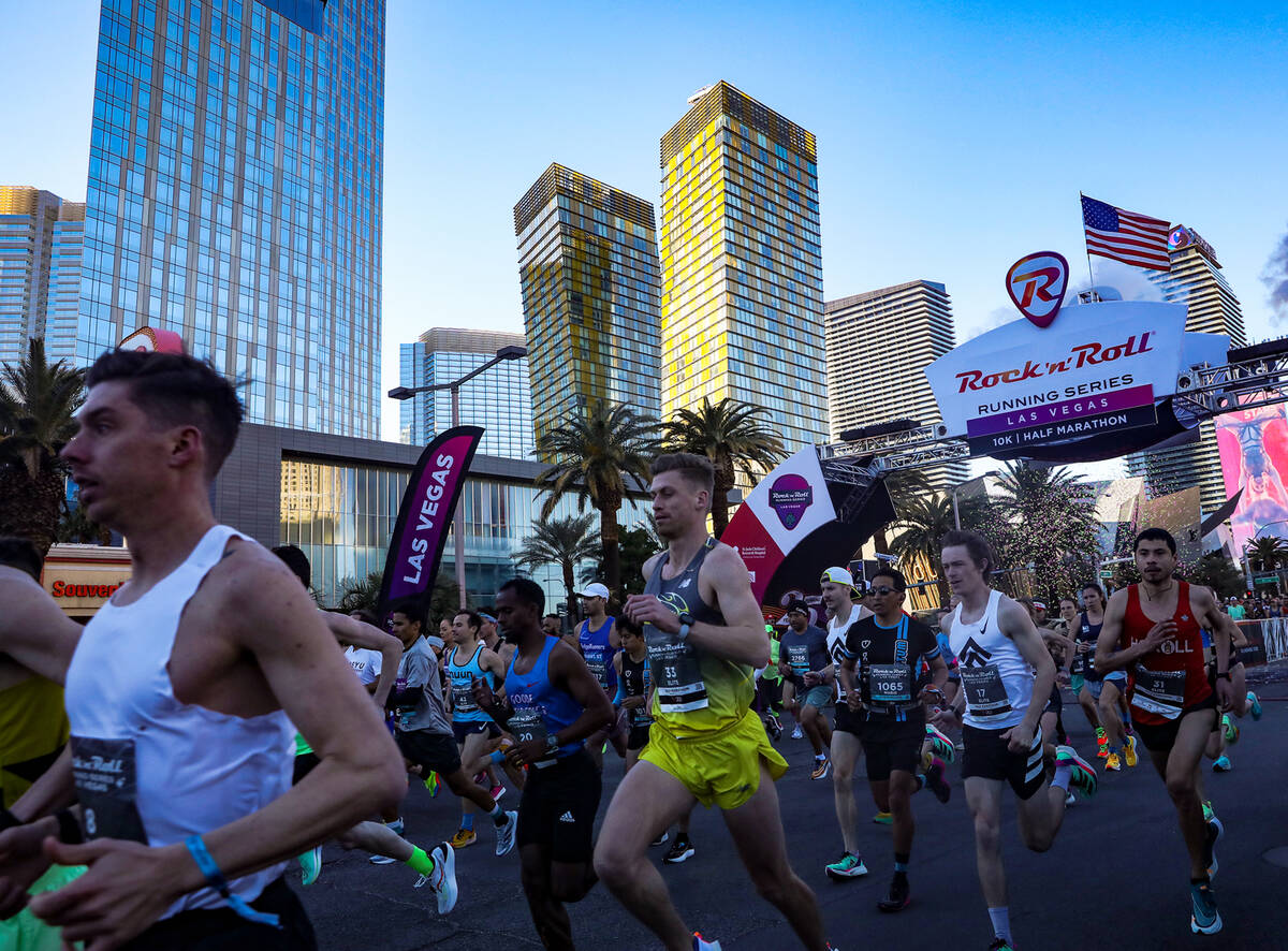 Runners race in the Rock ’n’ Roll Running Series Racing Event on the Strip in Las ...