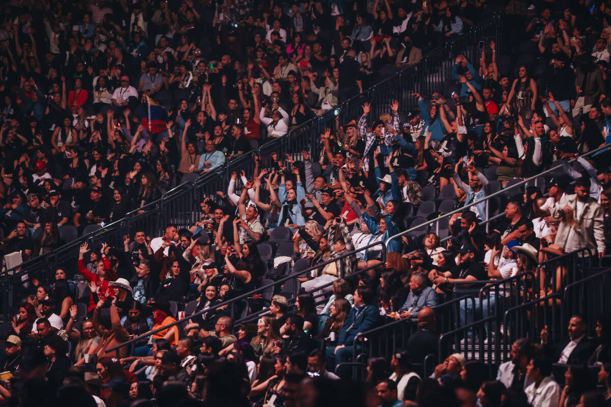 Bad Bunny fans do the wave while waiting for the singer to perform during his Most Wanted Tour ...