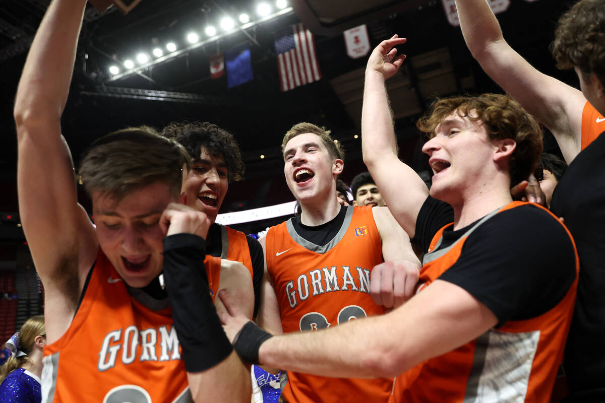 Bishop Gorman celebrates with their trophy after defeating Coronado in the Class 5A boys basket ...