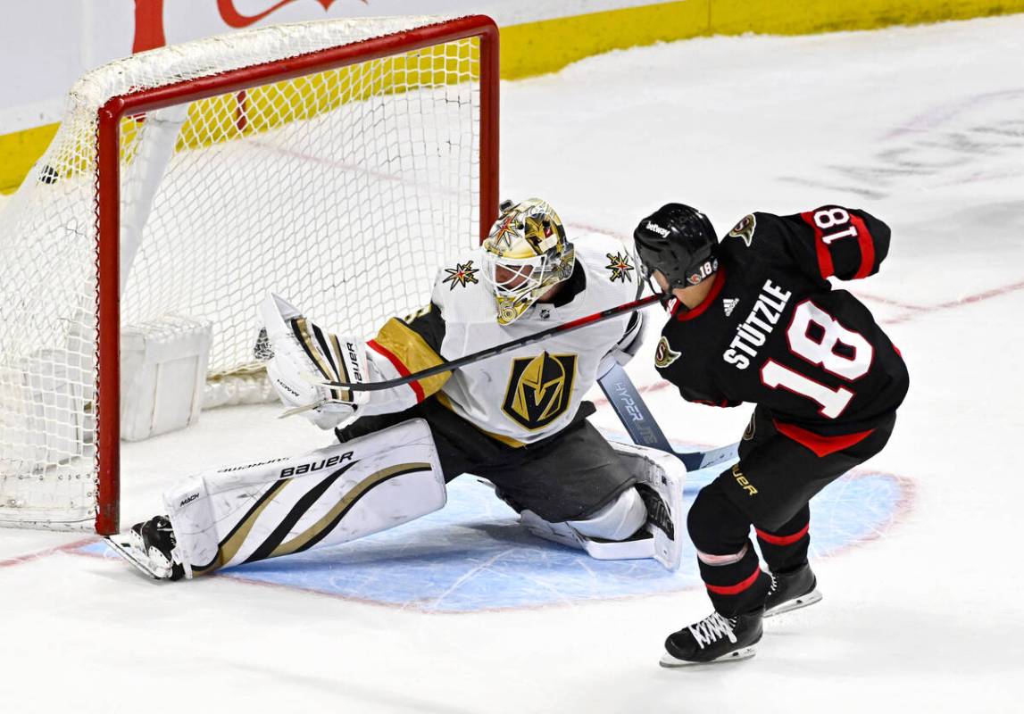 Ottawa Senators centre Tim Stutzle (18) scores on Vegas Golden Knights goaltender Logan Thompso ...