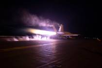 This image provided by the U.S. Navy shows an aircraft launching from USS Dwight D. Eisenhower ...