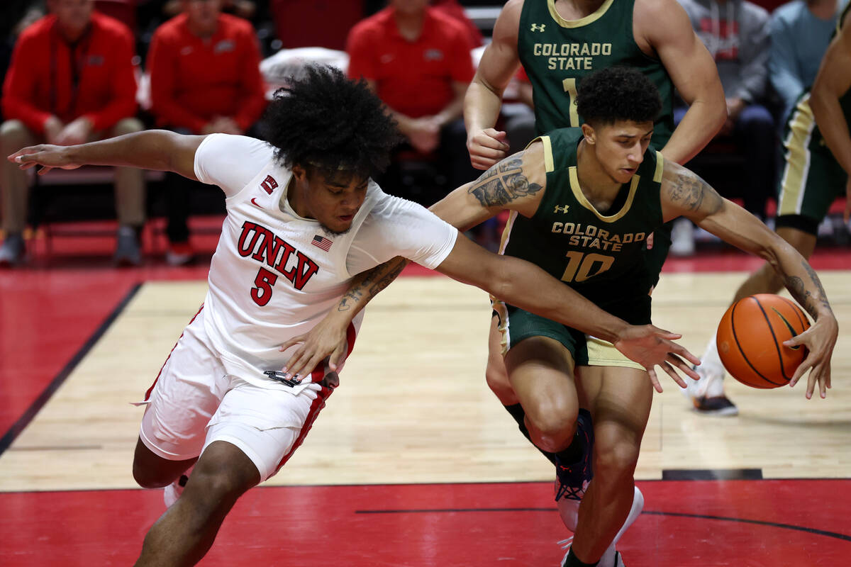 Colorado State Rams guard Nique Clifford (10) steals the ball from UNLV Rebels forward Rob Whal ...