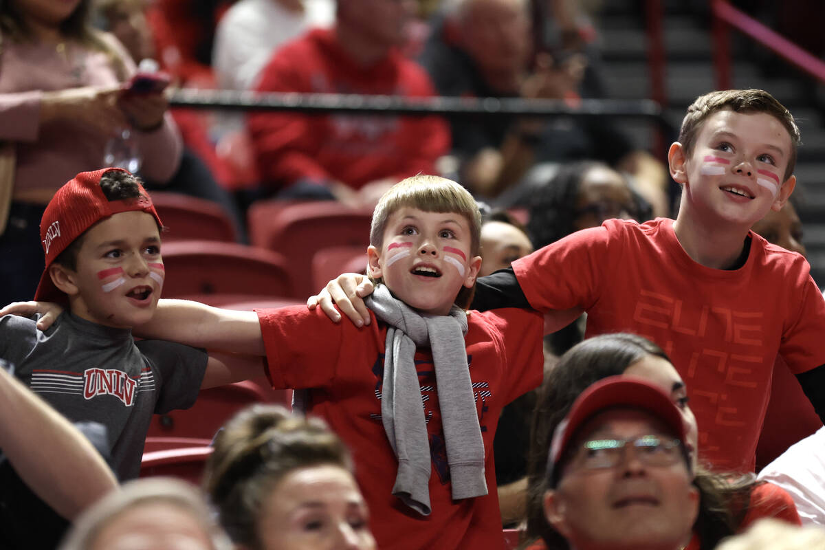 UNLV Rebels fans dance to the music during the second half of an NCAA college basketball game a ...