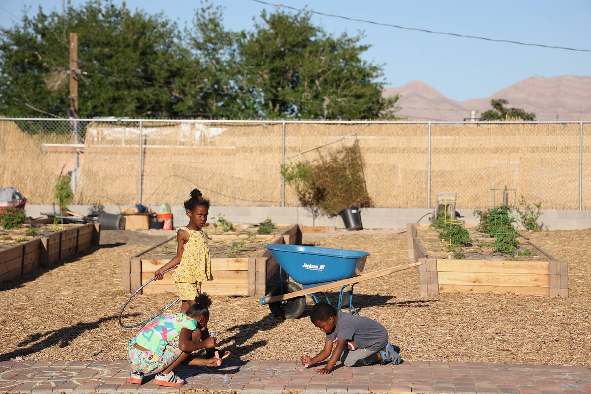 Children play at the opening of the Obodo Collective urban farm Saturday, April 22, 2023, in La ...