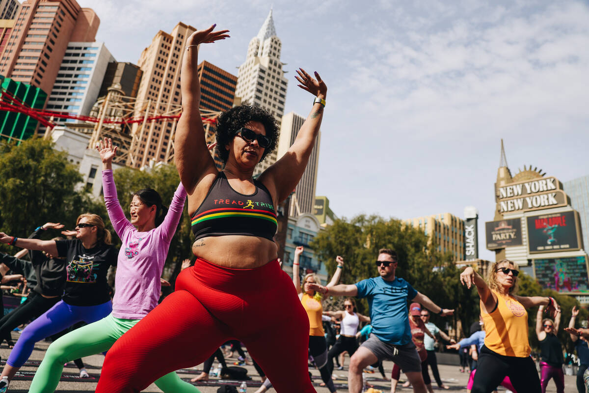 People gather on the Strip to do yoga while it is shut down for the Rock ’n’ Roll ...