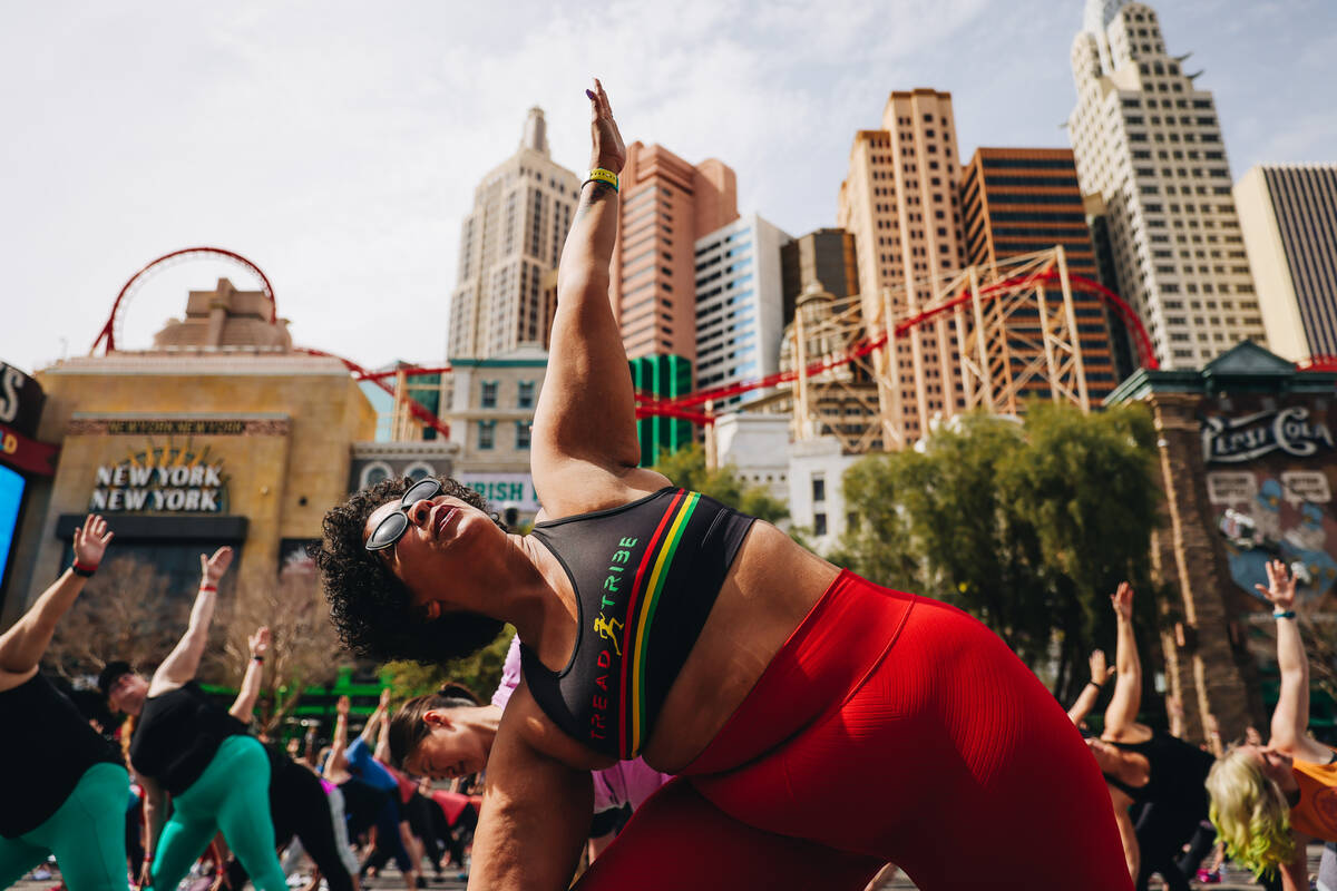 People gather on the Strip to do yoga while it is shut down for the Rock ’n’ Roll ...