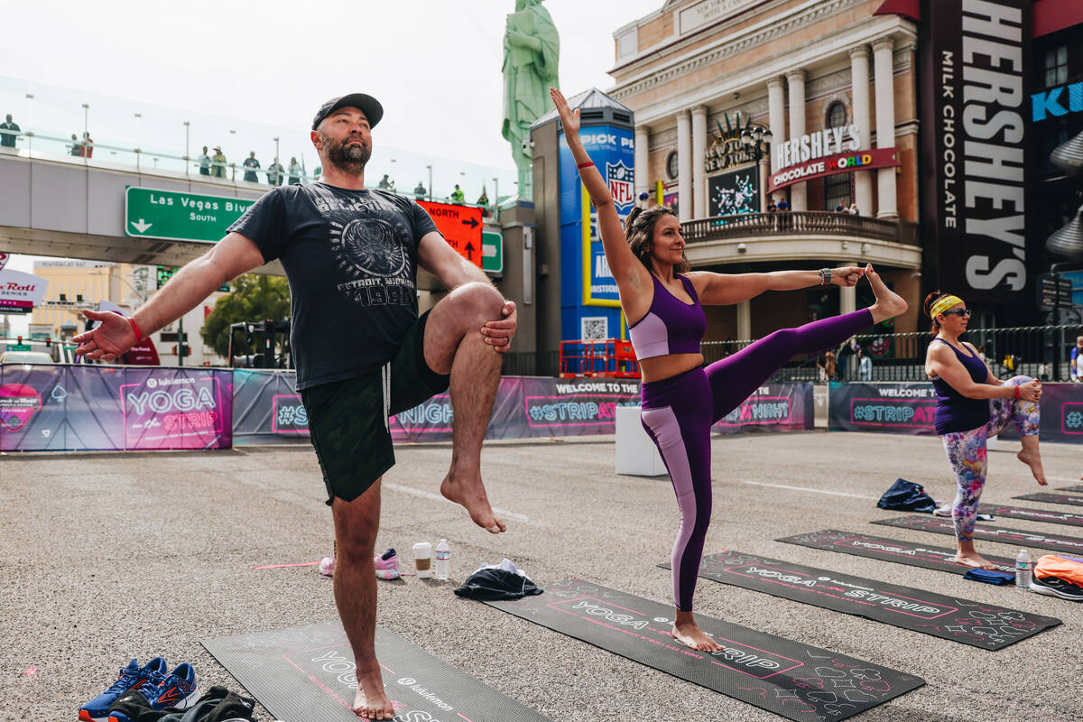 People gather on the Strip to do yoga while it is shut down for the Rock ’n’ Roll ...